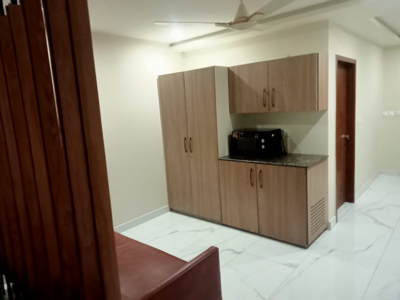 Built-in wooden cabinets and pantry